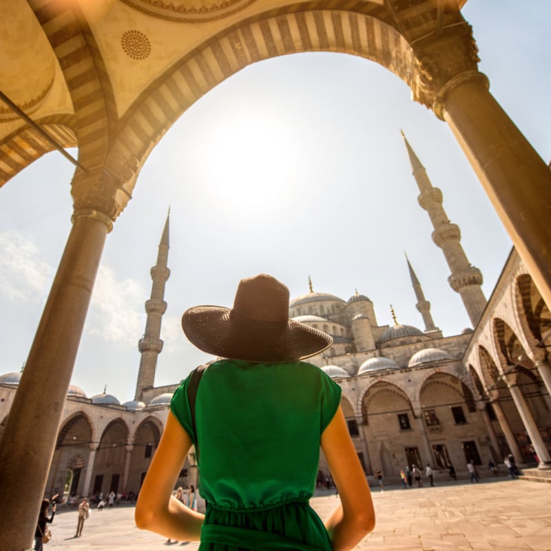 woman in front of the mosque in Türkiye