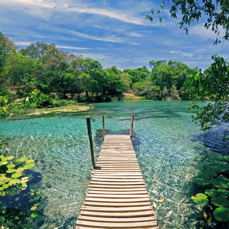 A wooden pier stretching out into a crystal clear lagoon near Diamantina, Minas Gerais state, Brazil, South America, Latin America
