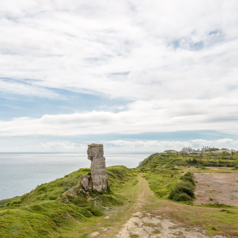 Nicodemus Knob, a limestone stack produced by nineteenth century quarrymen as a sea marker on the Isle of Portland in Dorset, England.
